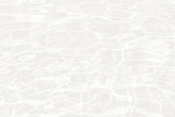Water surface reflecting light in a bright setting during daytime hours