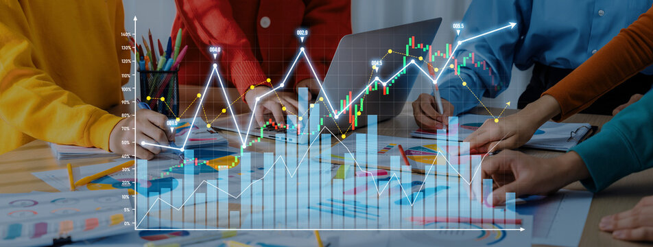 A diverse team engages in a collaborative financial analysis session, utilizing graphs and charts to enhance data-driven decision-making. The modern workspace encourages creativity and teamwork. Scalp - Powered by Adobe