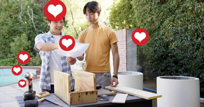 Mentor pointing plans, guiding teen measuring with tape for DIY woodwork by pool, hearts overlaying