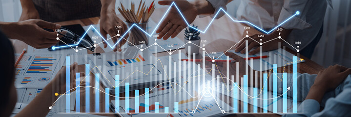 A business team collaborates in a modern office, analyzing financial growth strategies with charts and graphs to enhance data insights and drive success. Scalp