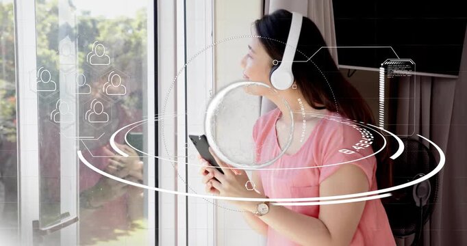 Woman tapping phone by glass door, tech HUD rings appearing around phone, showing icons for reading