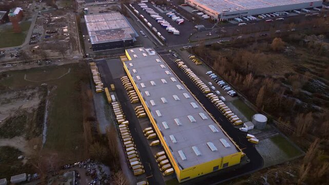 DHL Deutsche Post logistics center berlin city. Smooth aerial view drone