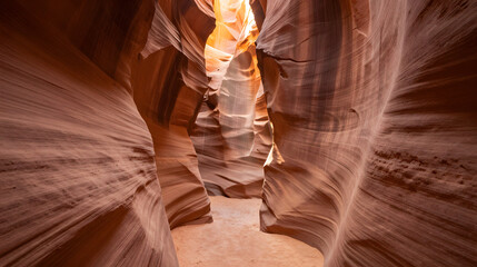 Naklejka premium Narrow canyon with sunlight creating soft golden beams through sandstone walls