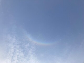 Obraz premium Delicate atmospheric halo above soft clouds