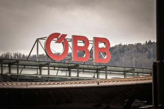 GRAZ, AUSTRIA - DECEMBER 22, 2024: Large red OBB letters sit atop a building in Graz. OeBB, or Osterreichische Bundesbahnen, is the main railway carrier in Austria.