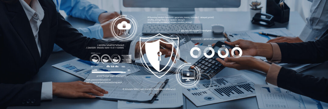 Business team engaged in strategic financial analysis, utilizing cybersecurity graphics and documents on the desk, highlighting data protection and collaboration efforts. Trope
