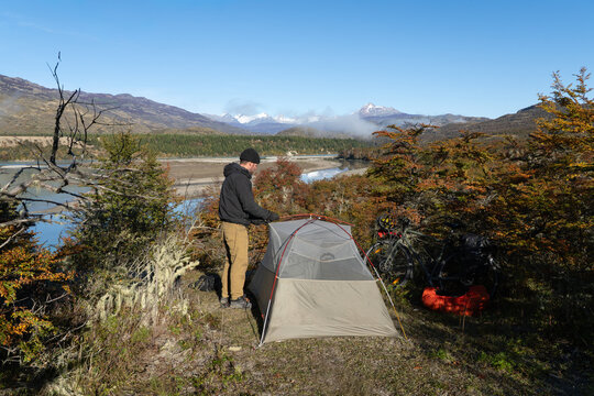 Wild camping by river with autumn colors on Carretera Austral, Patagonia, Chile