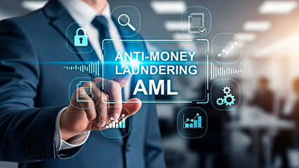 A businessman touching the Anti-Money Laundering text for the concept of finance, security and safety.