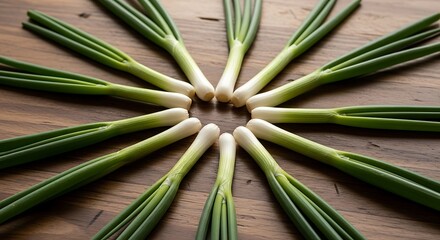 Fresh Green Onions Arranged in a Circular Pattern on Wood.