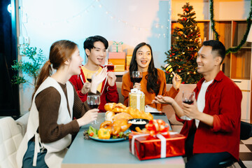 Group of Young Asian friend having, enjoy evening party together at home.