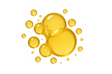 Golden yellow oil bubbles and serum drops creating an abstract liquid texture with transparent background