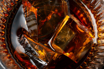 Macro Shot of Whiskey with Ice &ndash; Amber Scotch on the Rocks Close-Up