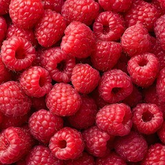 Fresh, juicy raspberries piled together.