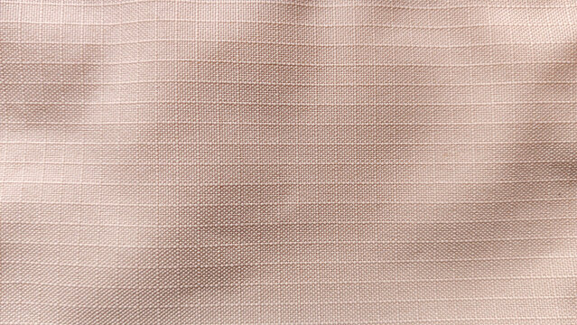 Neutral Tan Ripstop Fabric Texture Background with Uniform Horizontal Lines for Performance Apparel and Outdoor Gear