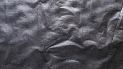 Abstract Crumpled Black Plastic or Fabric Texture with Repeating Grid Dot Pattern and Dramatic...