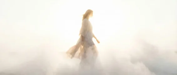 Sierkussen Meisjeskamer Caucasian woman walking through ethereal cloud and mist. Dreamlike fantasy scene evoking journey and spiritual path to 2026 color of the year. Banner with copy space  © Margarita Ratatosk