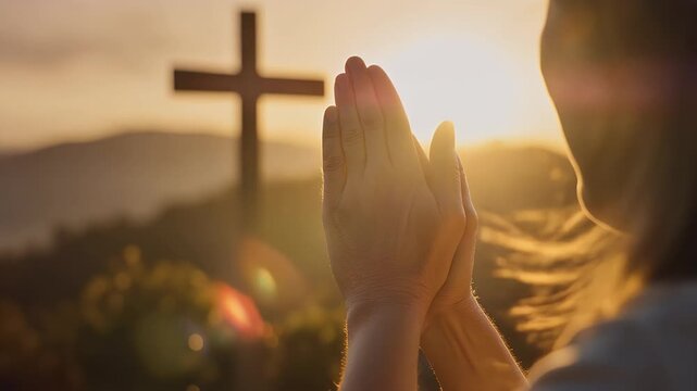 Woman praying at sunset with cross in background, seeking hope and faith during challenging times, offering praise and gratitude for blessings