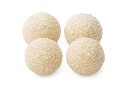 Four white coconut truffles creating a delicious dessert snack, sweet confectionery candy balls for holidays, transparent background