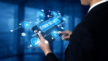 Business professional interacts with a futuristic digital interface showcasing cyber security icons, emphasizing data protection and technology in a modern office setting. Tessel