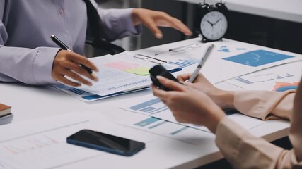 businesswoman using a calculator to calculate the numbers for financial document, finance accounting concept