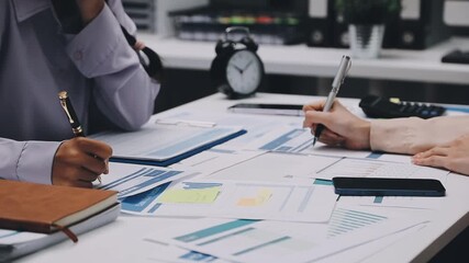 businesswoman using a calculator to calculate the numbers for financial document, finance accounting concept