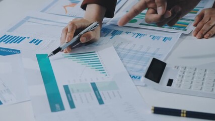 businesswoman using a calculator to calculate the numbers for financial document, finance accounting concept