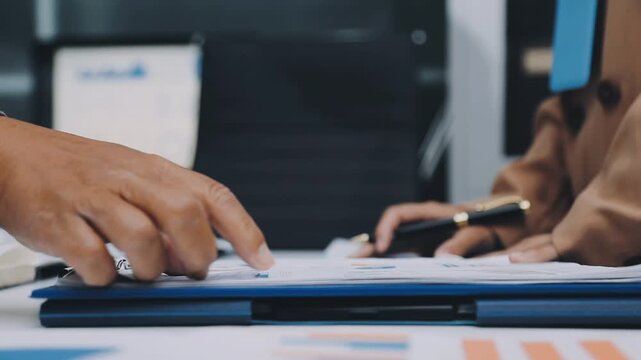 Young business people shaking hands in the office. Finishing successful meeting. Three persons
