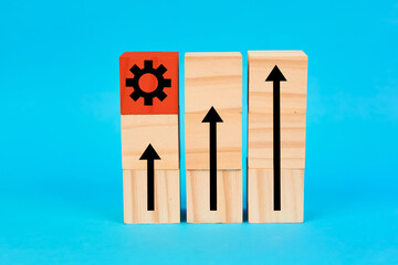 A performance and innovation concept illustrated by rising arrows alongside a highlighted gear block symbolizing engineering solutions and strategic improvement.
