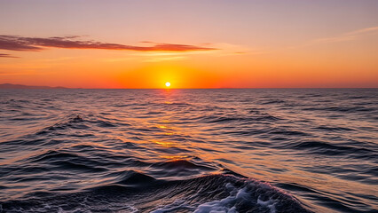 Vibrant sunset over the ocean, casting fiery orange and golden hues across tranquil waters and sky, a serene and picturesque natural spectacle