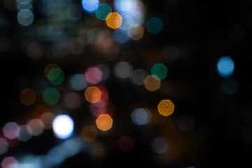 Blurred night background with colorful bokeh, copy space