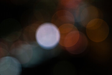 Blurred night background with colorful bokeh, copy space