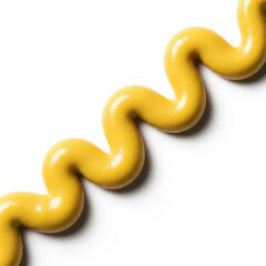 Obraz premium A vibrant yellow mustard squiggle forming a wavy pattern isolated on white background