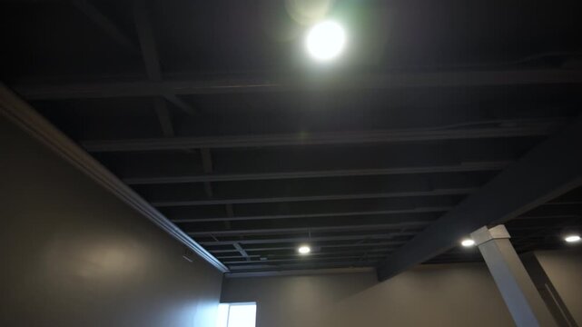 HVAC heating, air ventilation, conditioning systems under ceiling in the empty basement in residential house under renovation process