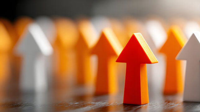 Orange arrows stand out amongst white arrows, symbolizing leadership and exceeding expectations in a business setting.