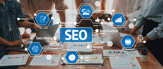 A dynamic team collaborates on SEO strategies, showcasing data insights with charts and graphs on a modern workspace, emphasizing teamwork and productivity in digital marketing. Amity