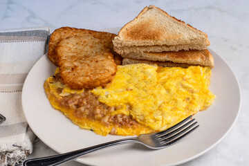 corn beef hash omelette with hash browns