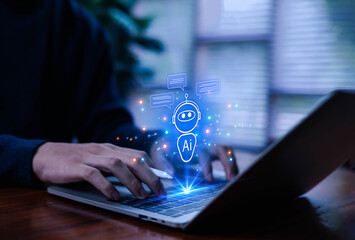 Man using laptop to chat with AI Chatbot Assistant or Artificial Intelligence Technology, Holographic Robot Application and Global Connectivity