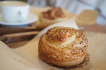 Freshly baked pastry with coffee in a cozy cafe setting