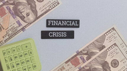 Financial Crisis Concept Illustrated with Calculator and US Dollar Banknotes Symbolizing Economic Downturn and Recession Risks