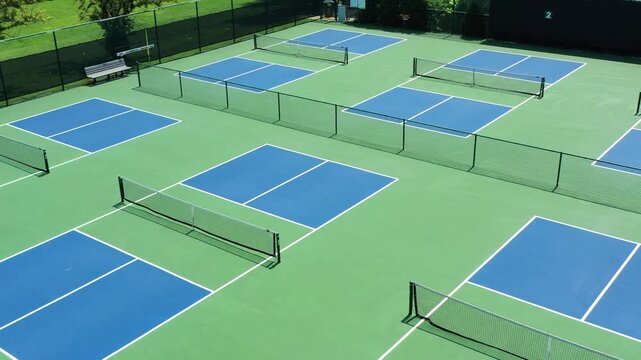 Aerial view of a pickleball facility in a suburban setting.
