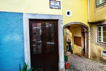 Fototapete Rund Enge Straßen Sintra is a charming village, famous for its UNESCO World Heritage Cultural Landscape, with romantic palaces, castles, charming streets, popular touristic destination offering history. Portugal. 2023  © Wagner