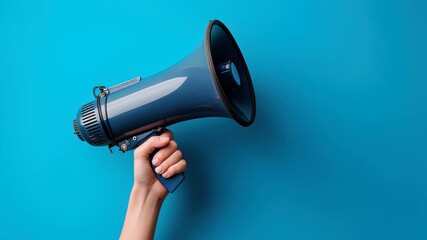 Hand Holding A Dark Blue Megaphone Against A Bright Blue Background