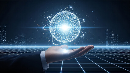 Hand holding glowing atom with orbiting electrons over futuristic grid background representing quantum computing and advanced technology.