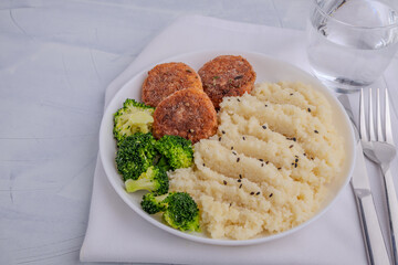 Healthy Meal with Couscous, Broccoli and Fish Patties
