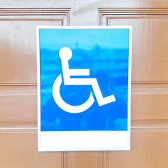 Blue Wheelchair Accessibility Sign for Public Facilities and Inclusive Service Areas