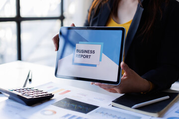 Analyzing data dashboard, business analytics, financial chart, and performance graph on laptop, working at office desk with report, modern technology, and professional focus
