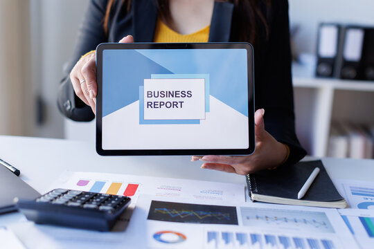 Analyzing data dashboard, business analytics, financial chart, and performance graph on laptop, working at office desk with report, modern technology, and professional focus
