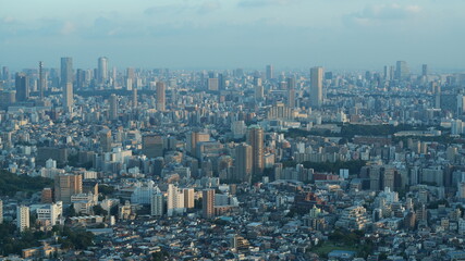 Fototapeta premium The panoramic Tokyo city view from the top of the skyscraper during the sunset time