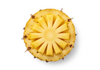 Vibrant yellow pineapple half sliced and carved into a striking radial pattern isolated on white.