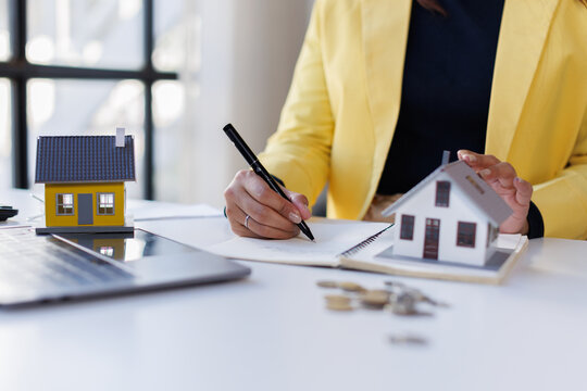 Finance bank tax expense accounting budget money business woman home for Business expense analysis saving use Financial calculate accountant close up calculator with graph chart hand write office desk - Powered by Adobe